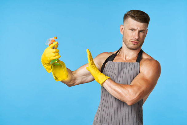 man wearing an apron detergent cleaning service housework - Fotoğraf, Görsel