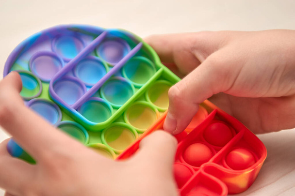 Silicone sensory fidget antistress toys pop it, simple dimple, pop tube. New popular trendy fidget - Photo, image