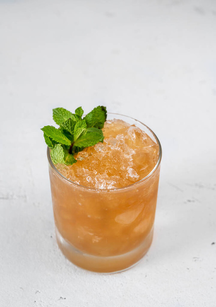 Glass of Ancient Mariner Cocktail garnished with fresh mint - Foto, Imagen