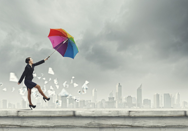 Businesswoman with umbrella - Fotoğraf, Görsel