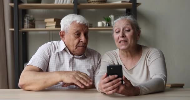 Happy mature parents communicate with adult children by videocall - Imágenes, Vídeo