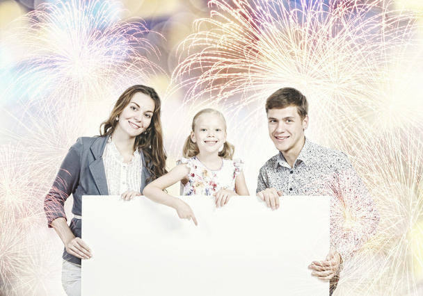 Family with white blank banner - Фото, изображение