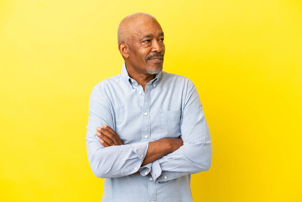 Cuban Senior isolated on yellow background happy and smiling - Foto, Imagen