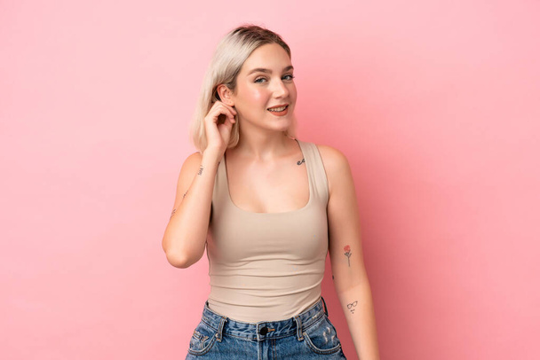 Young caucasian woman isolated on pink background laughing - Photo, Image