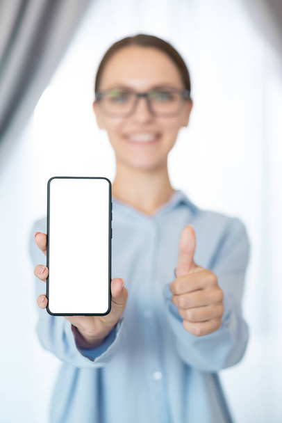app advertising woman mockup phone screen thumb up - Foto, Imagen