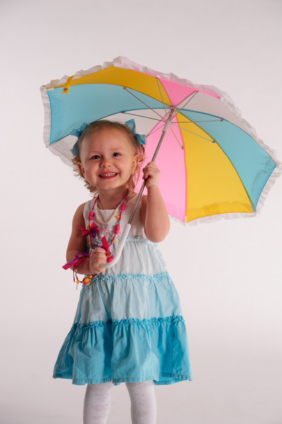 Little girl with umbrella - Photo, image