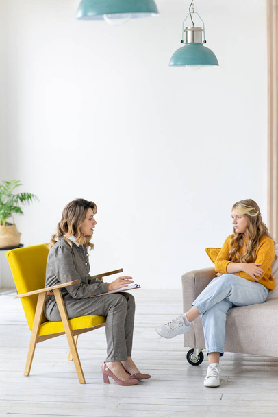 Woman psychologist works with teenage girl in her office. Mental health. - Foto, imagen