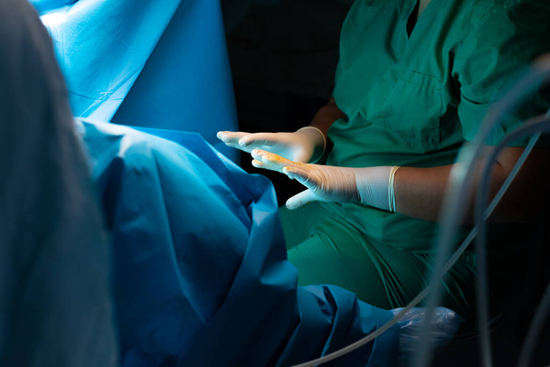 Surgeons hands in sterile latex gloves.  - Фото, зображення