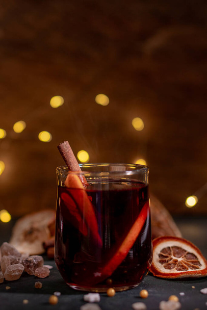 Gluhwein sweet hot warm Mulled red Wine or punch tea in mug cup glass spices citrus aromatic cinnamon star anise German tradition winter Christmas market beverage drink new year holidays festival - Foto, Imagem