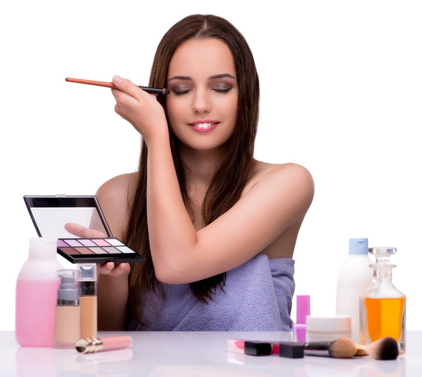 Woman applying make-up isolated on white - Photo, Image