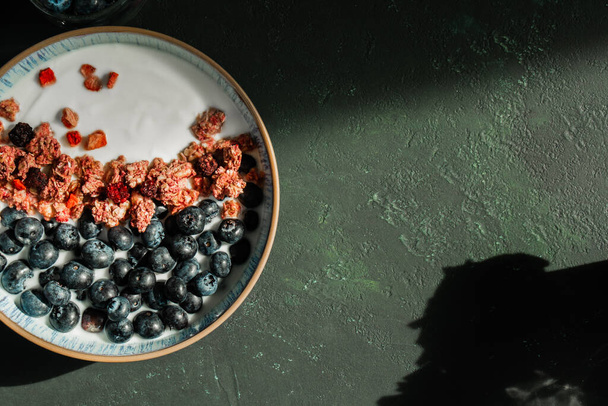 Berry mix bowl super food with healthy granola grain muesli in yogurt for breakfast food meal with honey blueberry strawberry - Zdjęcie, obraz