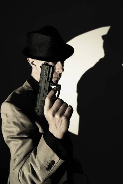 Spy thriller book cover design with man holding pistol gun. - Фото, изображение