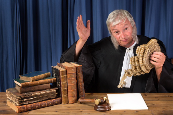 Judge taking wig off - Фото, изображение