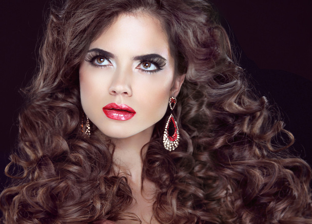 Beauty fashion girl. Wavy long hair. Brunette model with red lip - Photo, Image