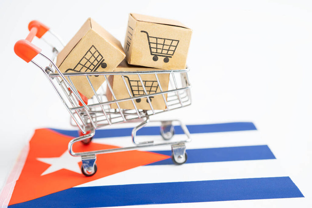 Box with shopping cart logo and Cuba flag, Import Export Shopping online or eCommerce finance delivery service store product shipping, trade, supplier concept. - Photo, Image