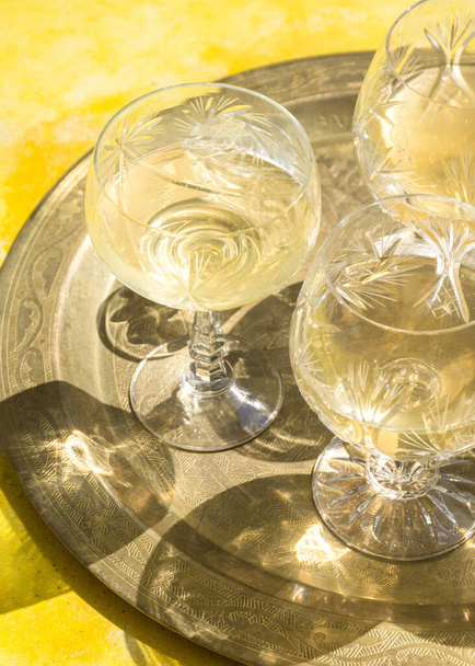 A top view of cocktail glasses shin under the sunlight - 写真・画像