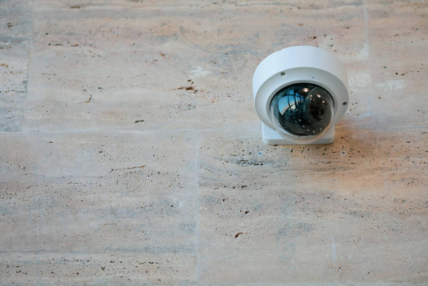 Details with a CCTV camera on a wall inside a building. - Photo, Image