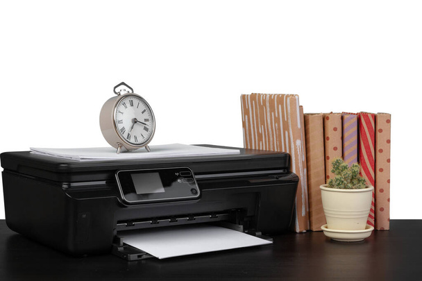 Office table with laser printer and books against white background - Photo, Image