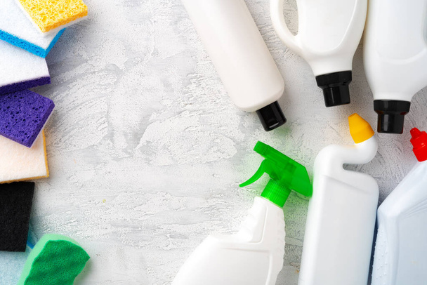 Set of different bottles of detergents top view on grey background - Foto, imagen
