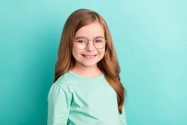 Photo of young attractive lovely girl happy positive smile confident wear glasses isolated over teal color background. - 写真・画像