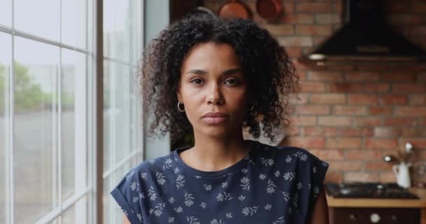 Headshot portrait sad 30s African woman staring at camera - Video, Çekim
