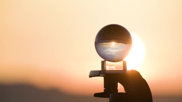Timelapse of an autumn landscape at sunset in the mountains through a crystal ball - Footage, Video