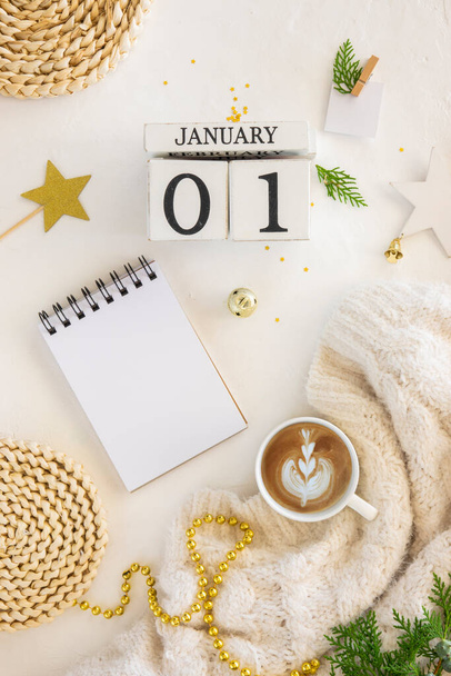 New year to-do list mockup. 01 Janyary on a calendar, top view layout with empty notebook on white background with xmas decorations. Christmas background with notebook for wish list or to do list - Zdjęcie, obraz