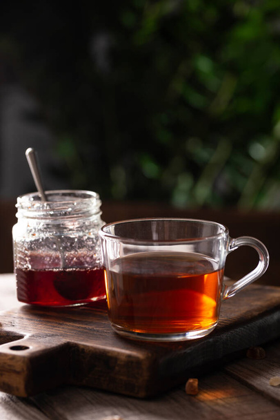 Cup of hot tea with sugar lollipops - Фото, зображення