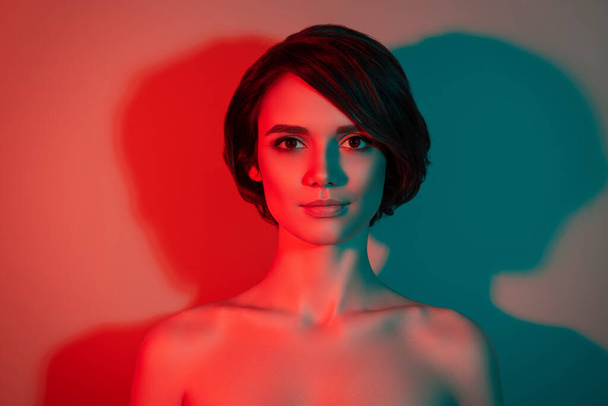 Photo of charming calm peaceful lovely bob hairdo woman look camera isolated red neon light color background - Photo, image