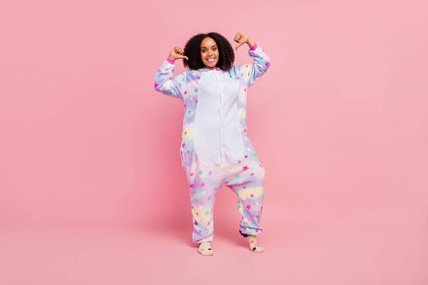 Full length profile side photo of youth african girl wear overall indicate thumb herself choice choose isolated over pink color background. - Foto, Imagem