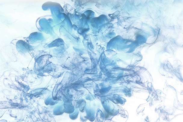 Blue smoke on white ink background, colorful fog, abstract swirling ocean sea, acrylic paint pigment underwater - Fotoğraf, Görsel