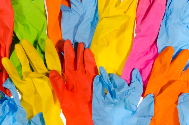 Background of multi-colored latex gloves. - Foto, Bild