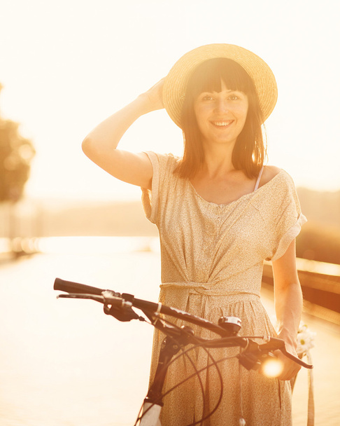 Girl with her bicycle - Photo, image