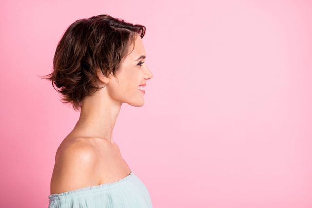Profile side photo of young attractive woman happy positive smile look empty space isolated over pink color background. - Fotó, kép