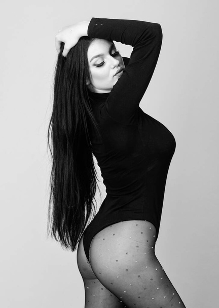beauty with long brunette hair. underwear fashion. seduction. Fitness and diet. sexy girl in bodysuit and tights. woman with sexy fit body. Young and carefree - Zdjęcie, obraz