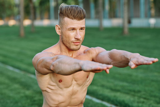 Muscled Man Doing Exercises Outdoor Fitness Summer - 写真・画像