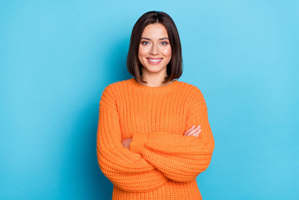 Portrait of attractive cheerful content girl folded arms wearing warm wool jumper isolated over bright blue color background. - Fotó, kép