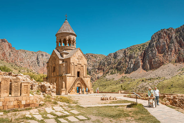 27 May 2021, Noravank, Armenia: Many people tourists and visitors have come on an excursion and are walking around the territory of the Noravank Monastery - Photo, Image
