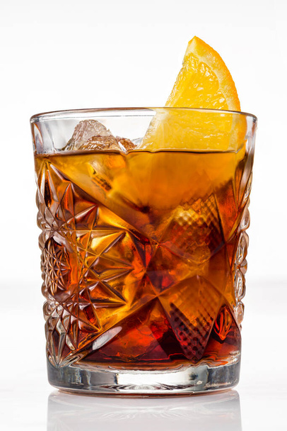 Americano or Negroni cocktail with orange slice in the rocks glass isolated, alcoholic cocktail with slice of orange on white background. - Photo, Image