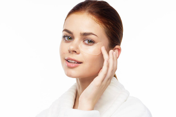 pretty woman in white robe face skin care collagen - Фото, зображення