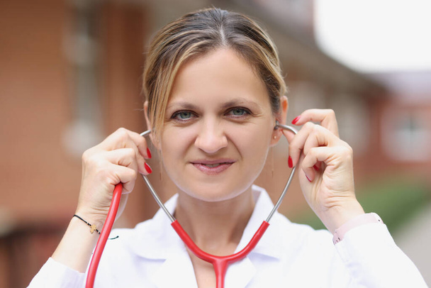 Portrait of young female medical doctor with stethoscope - Фото, зображення