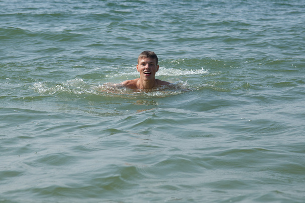 A boy swimming - Photo, Image