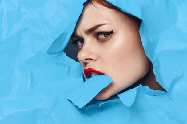 female face blue background red lips makeup emotions - Фото, изображение