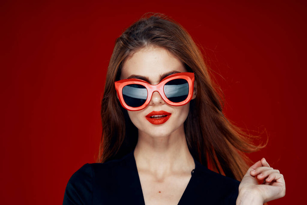 glamorous woman wearing sunglasses red lips posing close-up - Фото, изображение