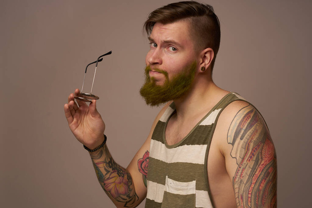 brutal man tattoos on his arms posing lifestyle form cropped view - 写真・画像