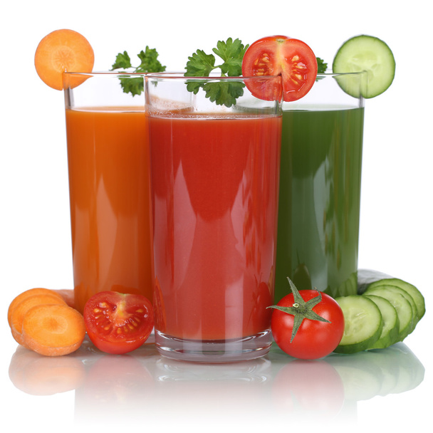 Healthy vegan eating vegetable juice from carrots, tomatoes and  - Zdjęcie, obraz
