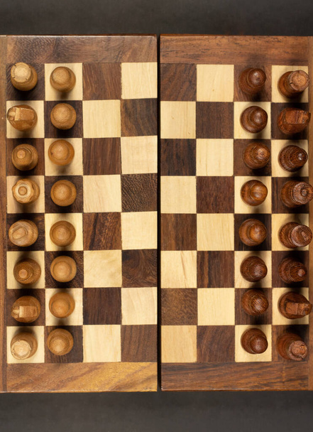 wooden chessboard viewed from above - Φωτογραφία, εικόνα