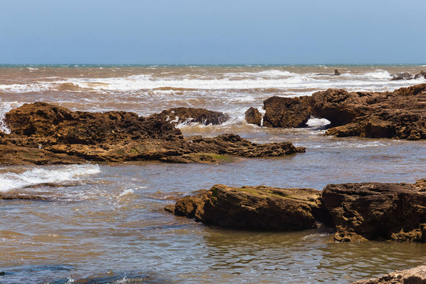 Volcanic coast of the Atlantic ocean in the Essaouira on a sunny summer day. Morocco. - Photo, image