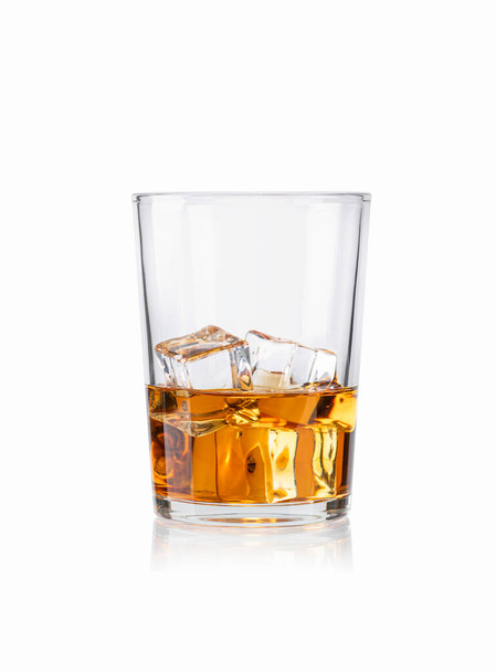 Glass of scotch whiskey and ice isolated on white background - Photo, Image