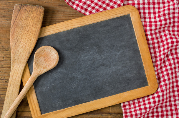 Chalkboard with wooden spoons on a red checkered tablecloth - Photo, Image